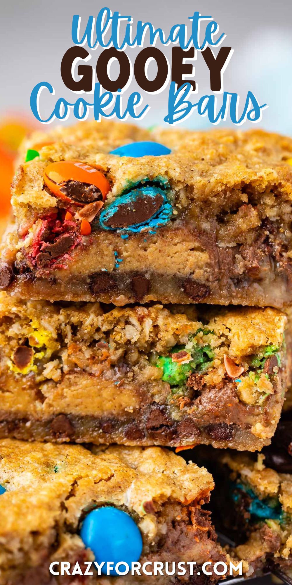 stacked gooey bars with M&Ms baked in with words on top