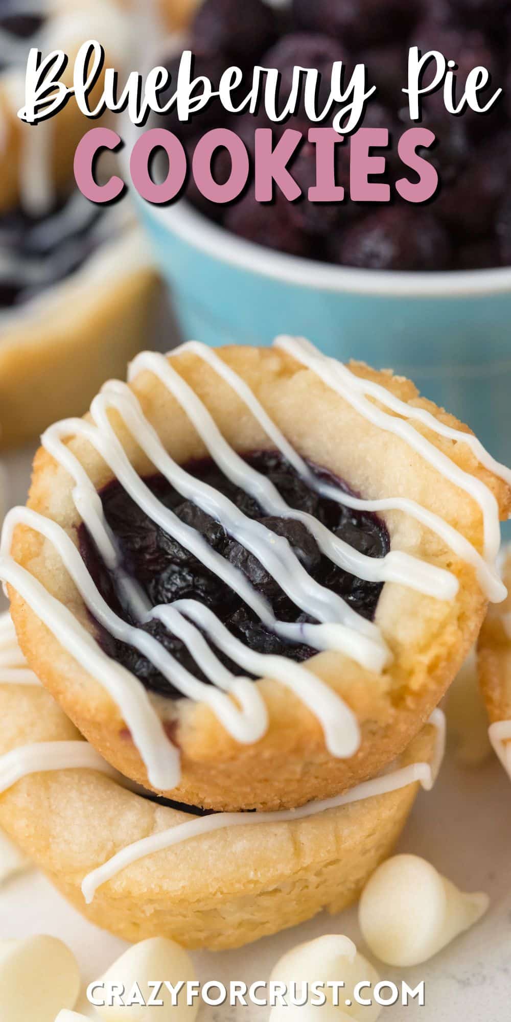 blueberry cookies with white icing dripped on top and words on the image