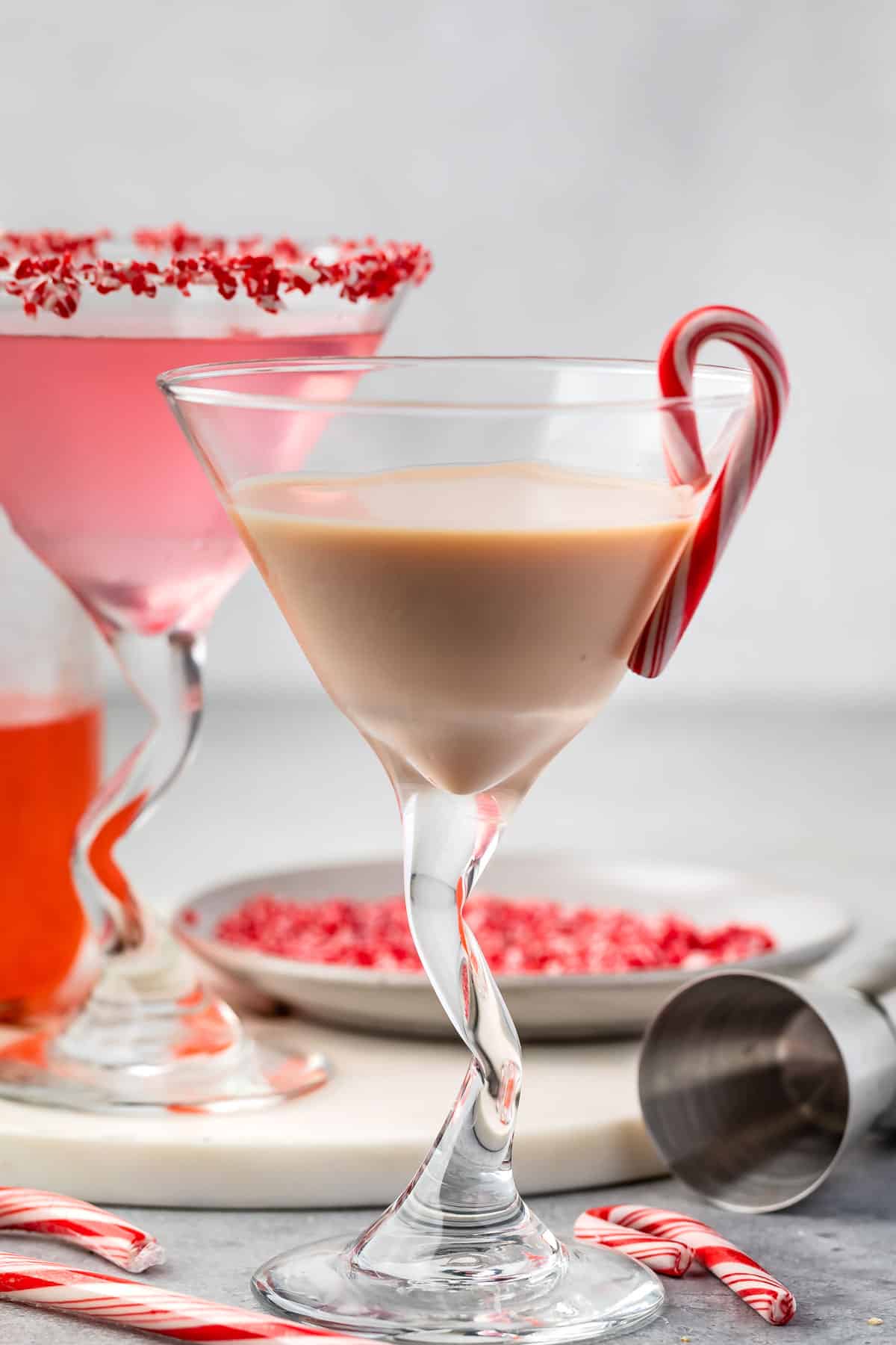 chocolate martini in martini class with a candy can on the rim