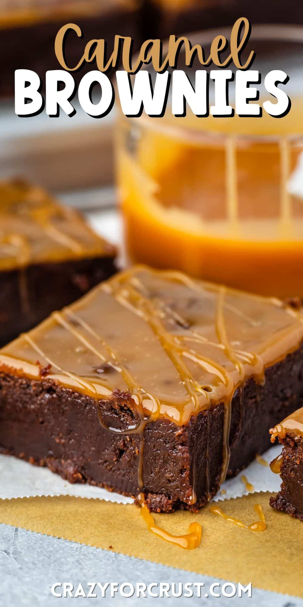 a brownie with caramel baked and dripped on top with words on the image