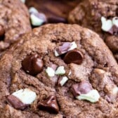 chocolate cookie with mint and chocolate chips baked in with words on top