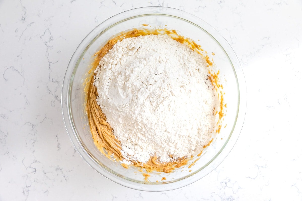 bowl of peanut butter cookie dough and flour