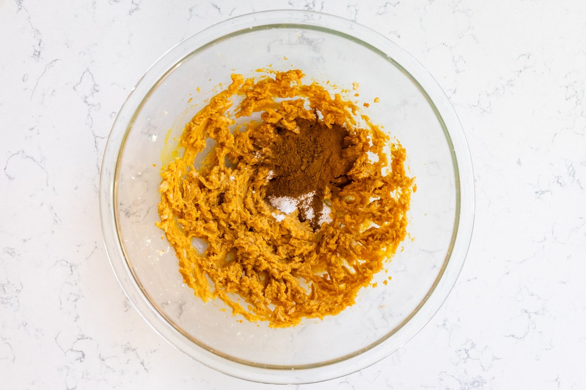 pumpkin mixture in glass bowl with spices.