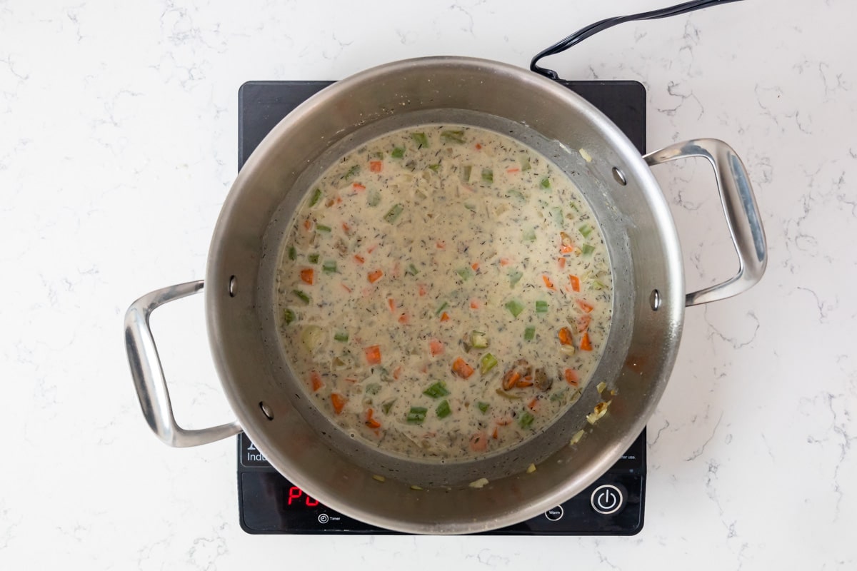 pan on hot plate with pot pie sauce cooking.