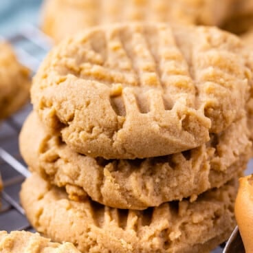 stack of 3 peanut butter cookies on rack