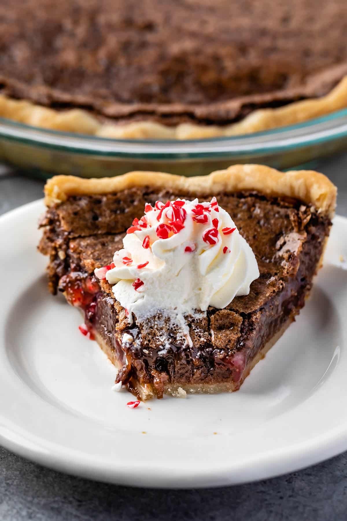 chess pie with whipped cream on and peppermint on top