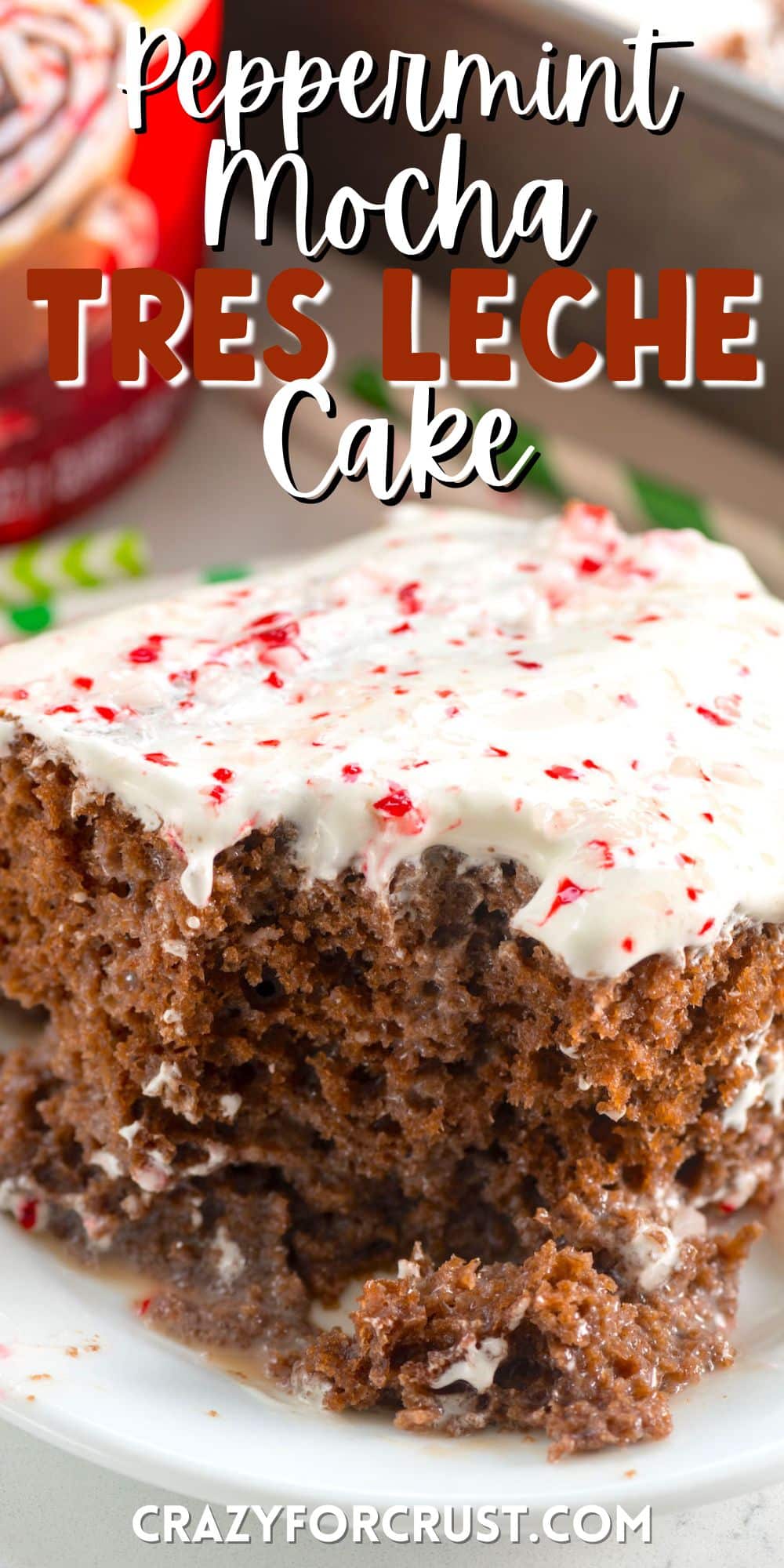 cake with white frosting and crushed peppermint on top on a white plate with words on the image