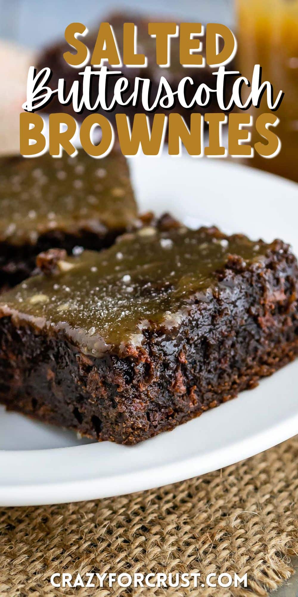 brownie on a white plate and topped with caramel and words on the image