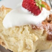slice of French toast with whipped cream and a strawberry on top with words on top