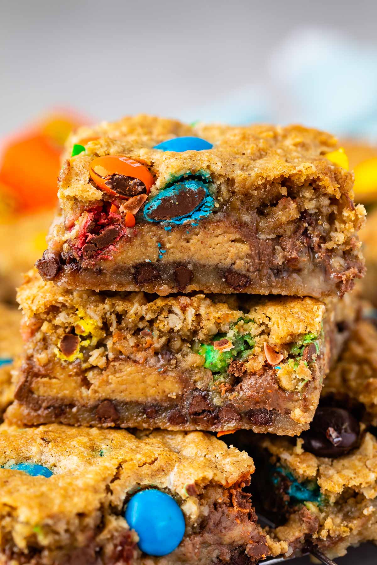 stacked gooey bars with M&Ms baked in