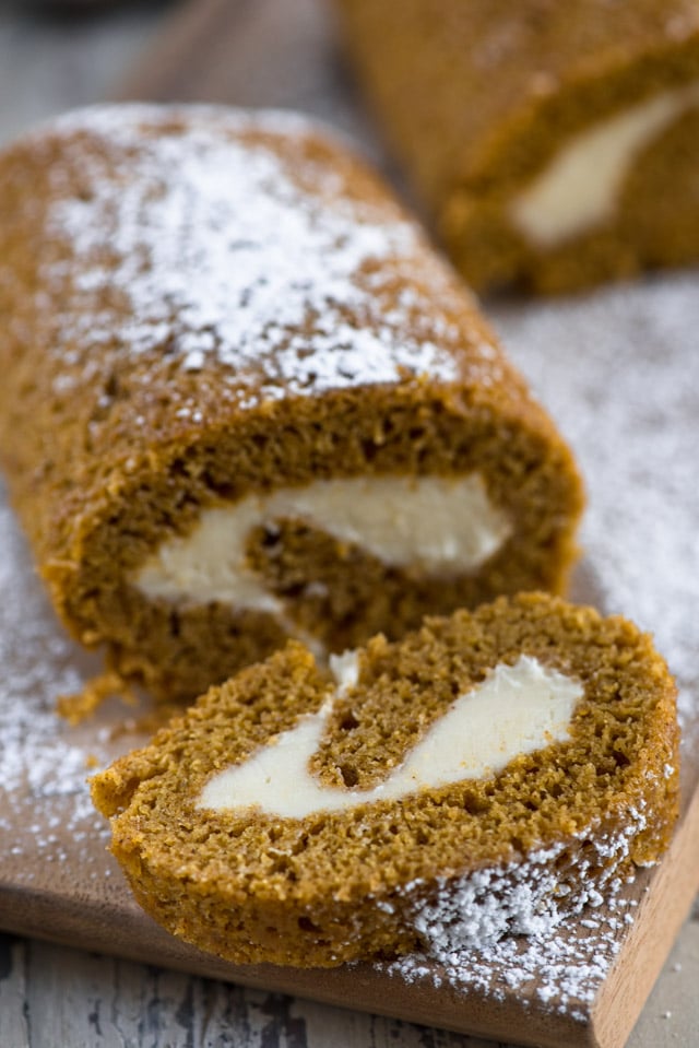 roll cut on a cutting board with powdered sugar on top