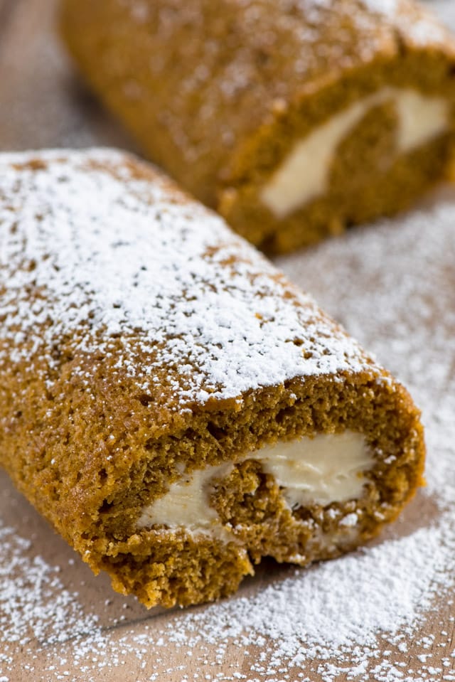 roll cut on a cutting board with powdered sugar on top