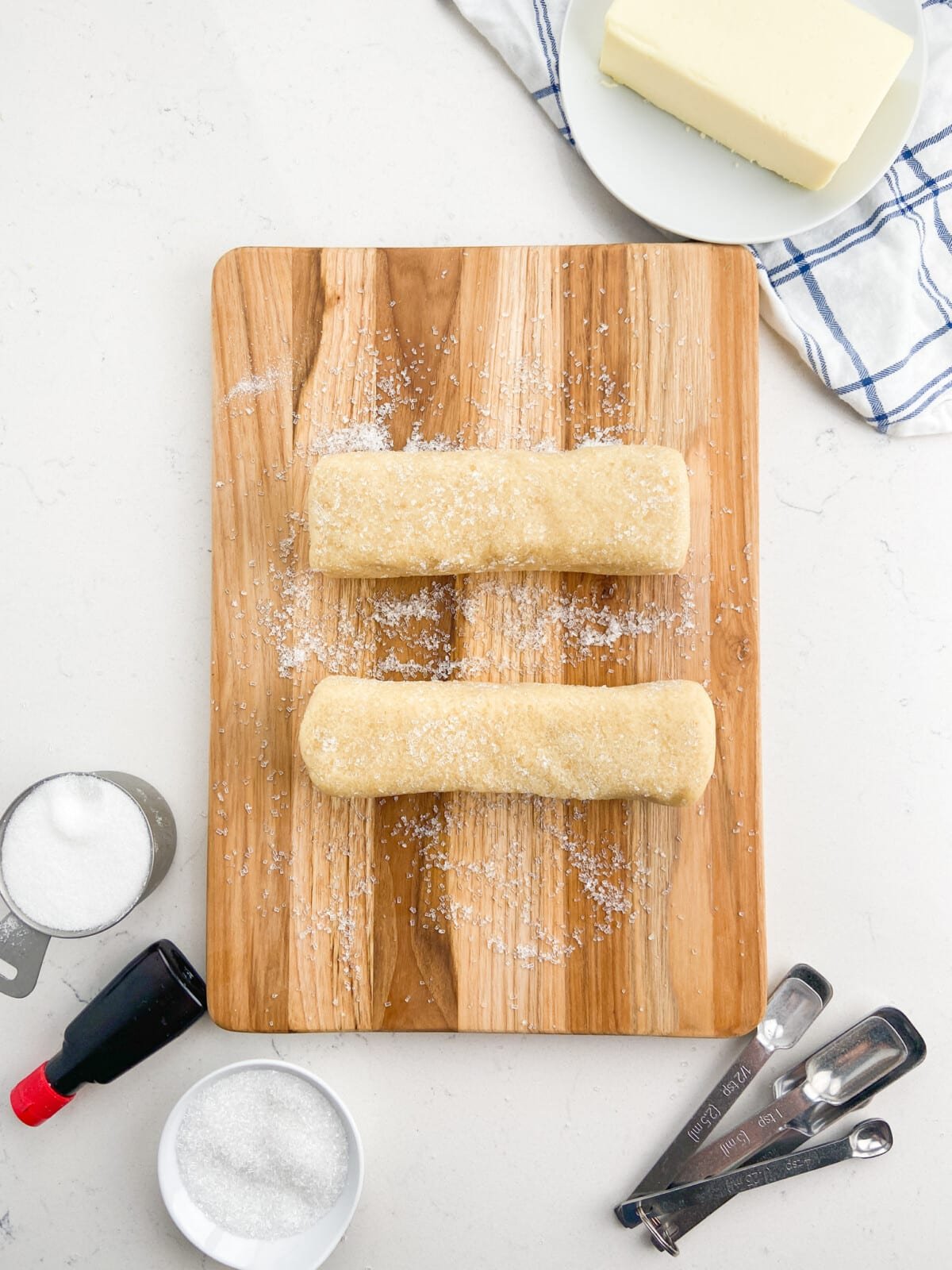 2 cookie logs on cutting board.