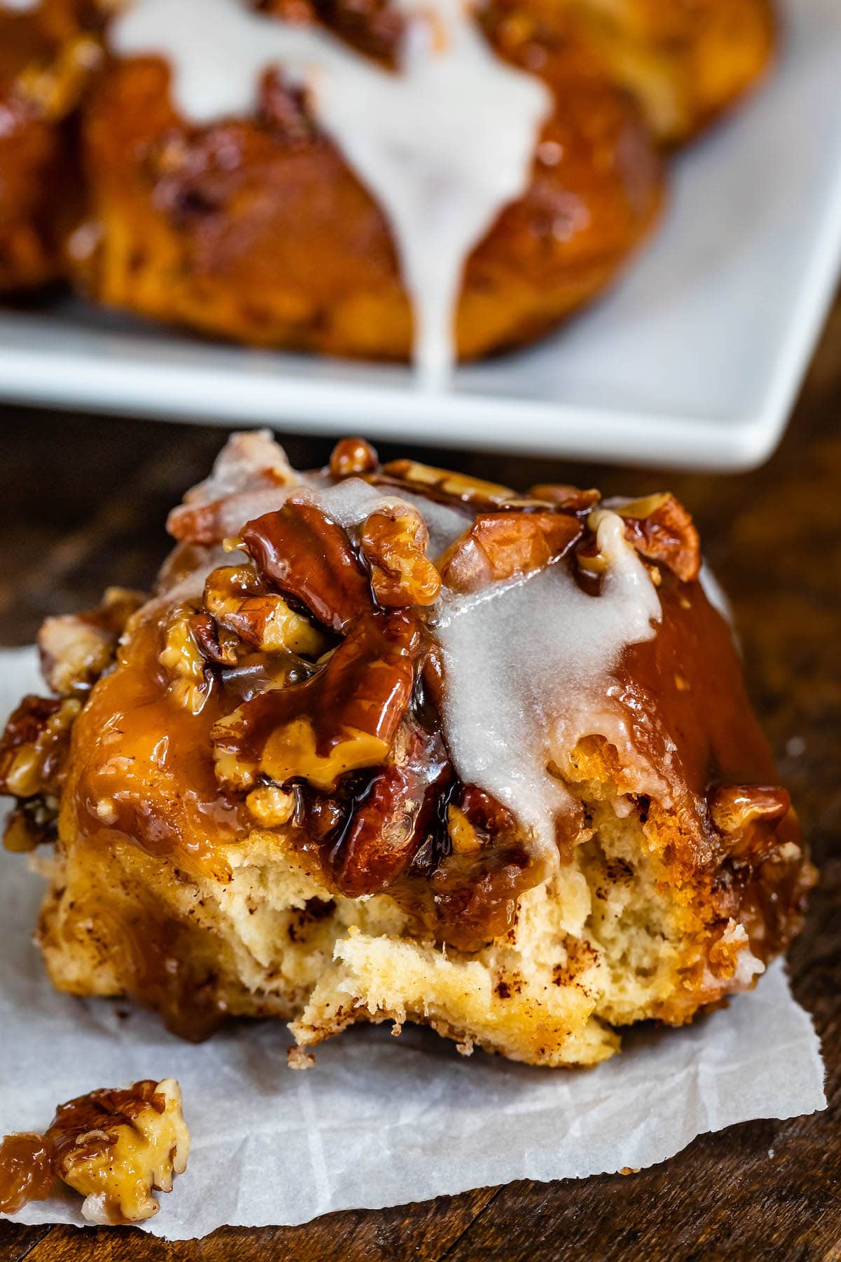 one sticky bun being sat on parchment paper