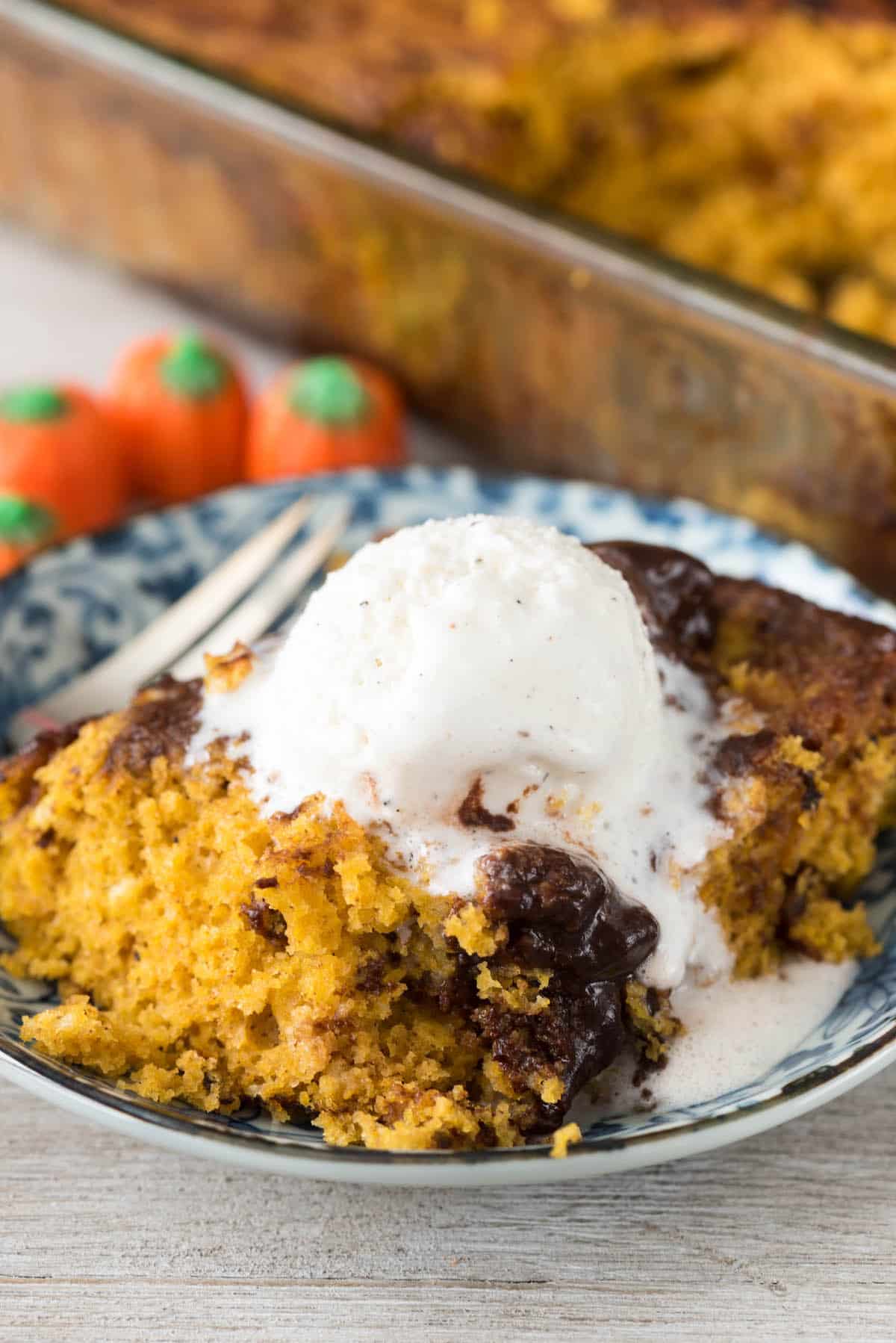 hot fudge cake in a blue bowl with ice cream on top