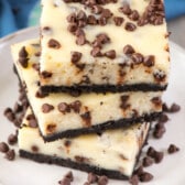 stack of 3 cheesecake bars on white plate