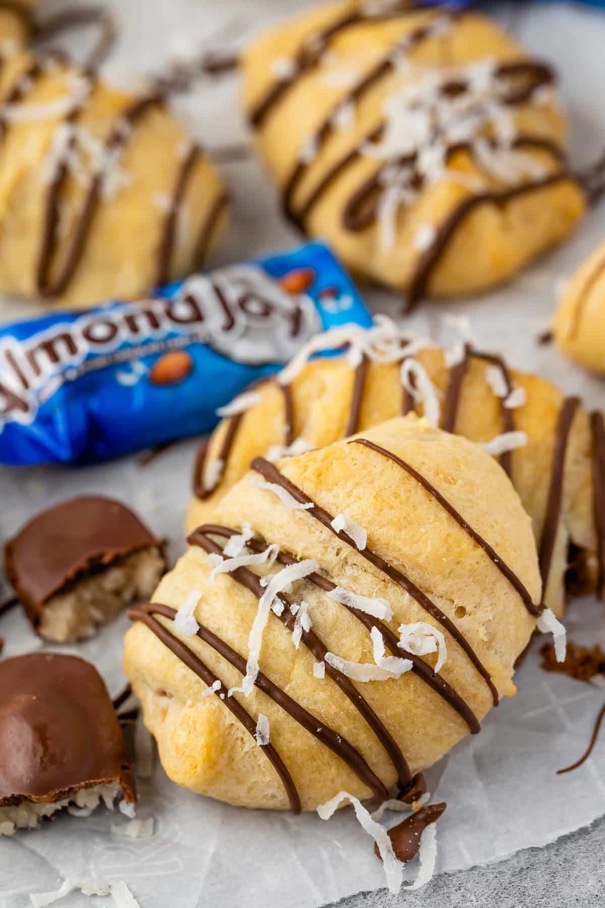 crescent rolls laid out on parchment paper