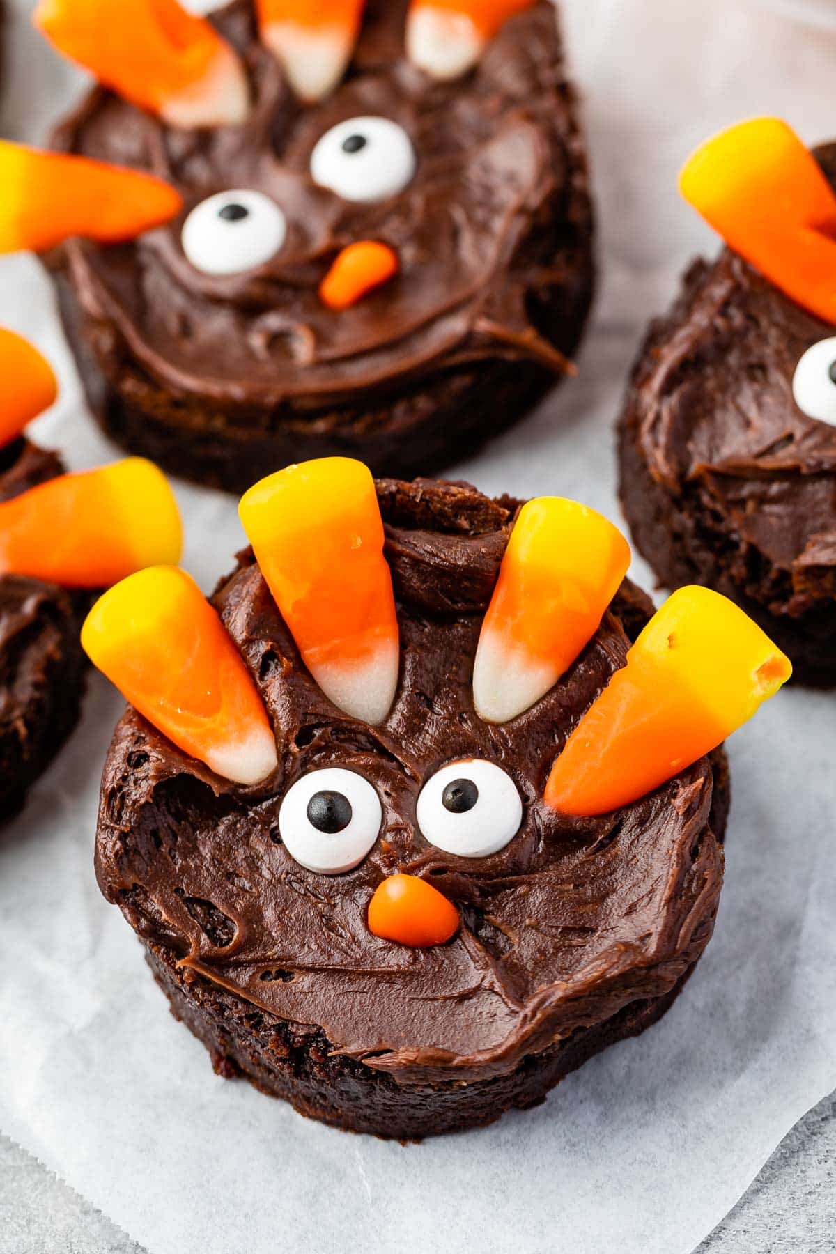 circle brownie with candy corn and candy eyes on the brownie