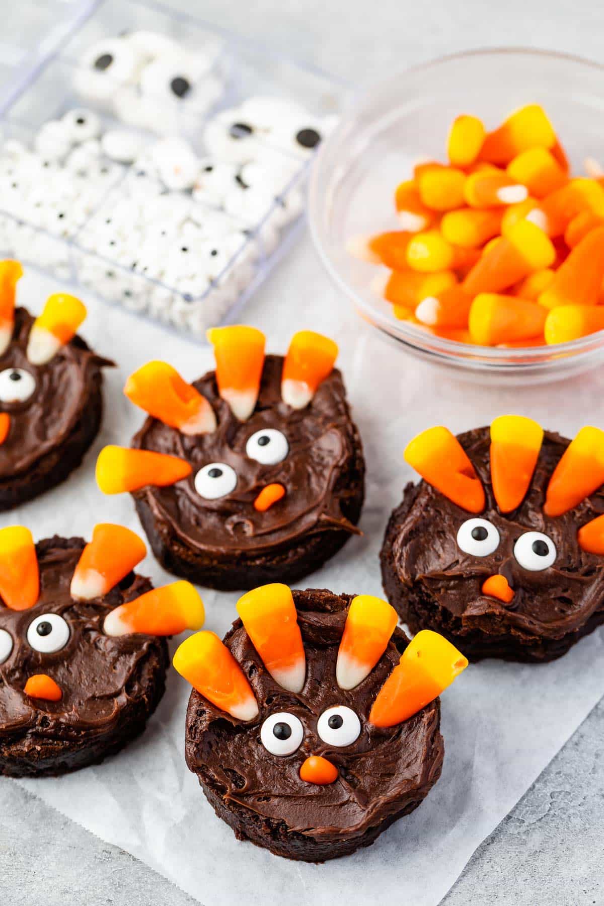 circle brownie with candy corn and candy eyes on the brownie