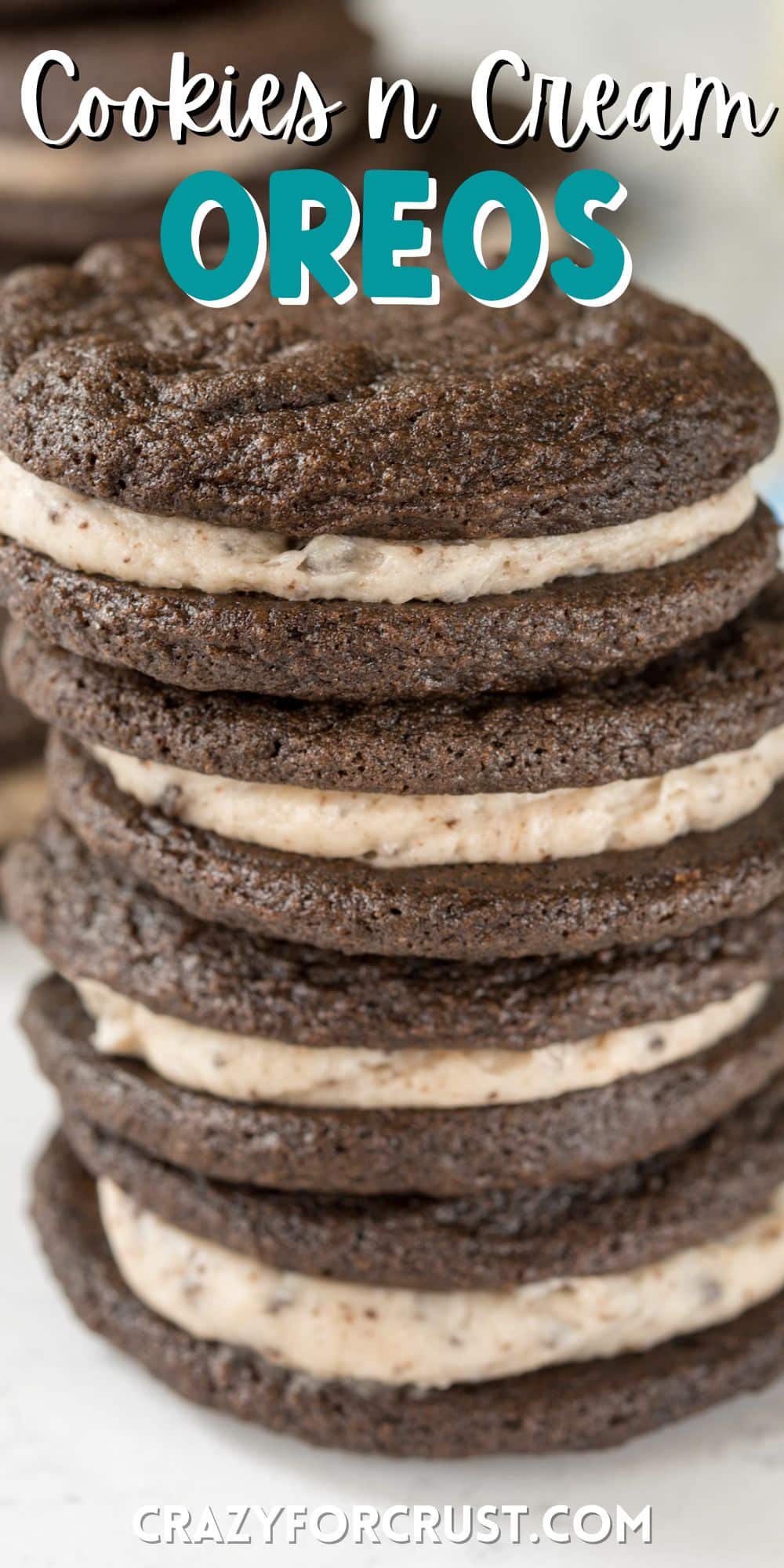 stacked homemade Oreos on a countertop with words on top