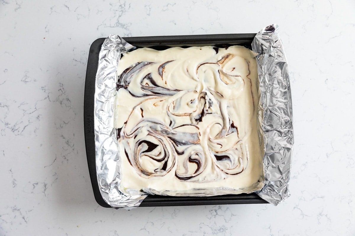 swirled batter in square pan with foil.