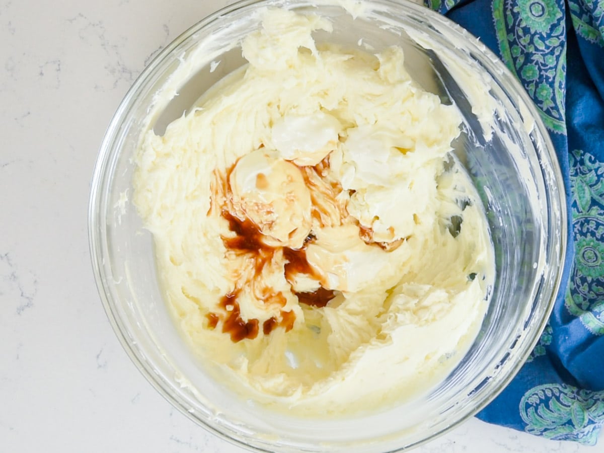 bowl of cheesecake batter with vanilla extract
