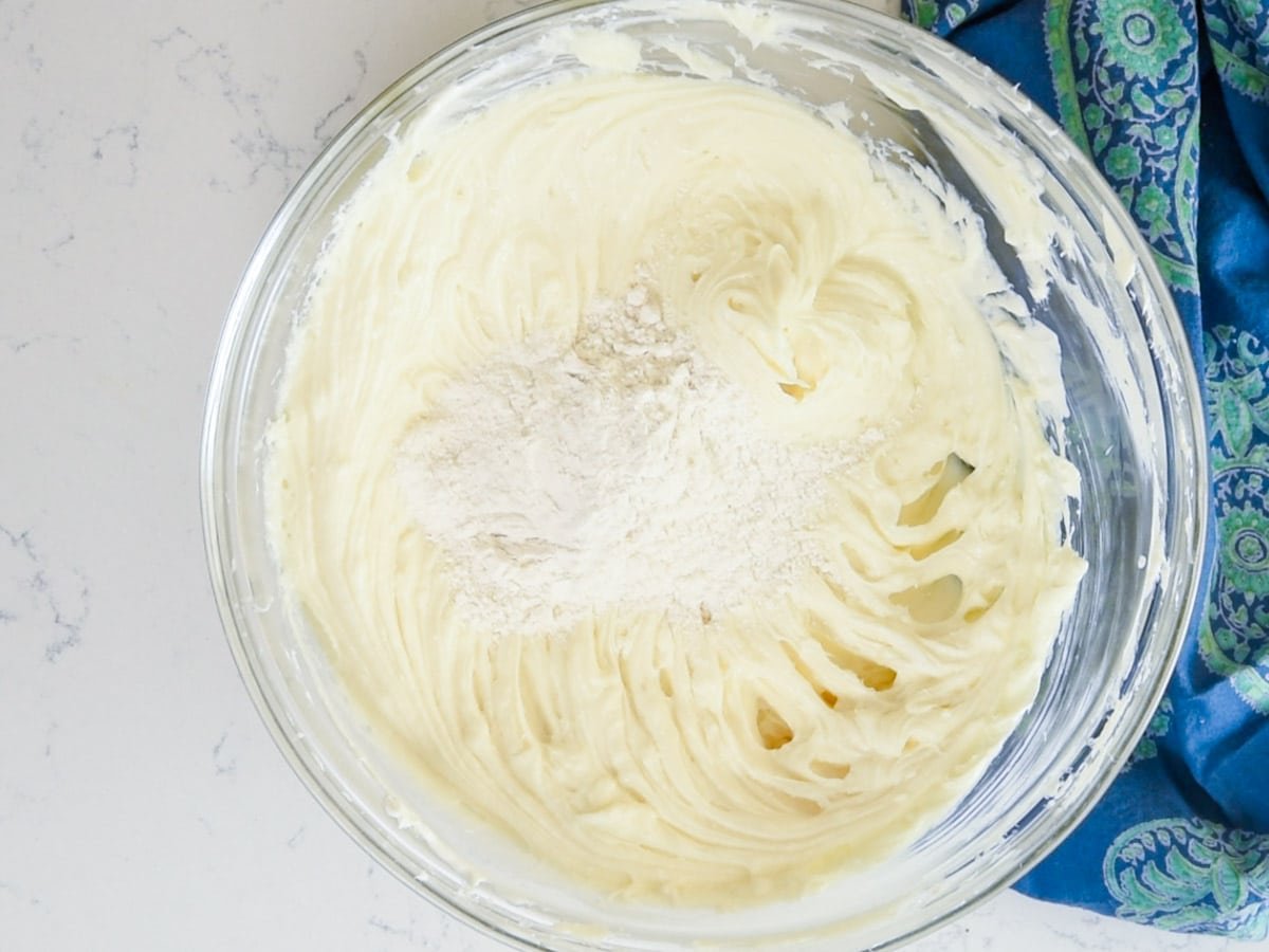 bowl of cheesecake batter with flour