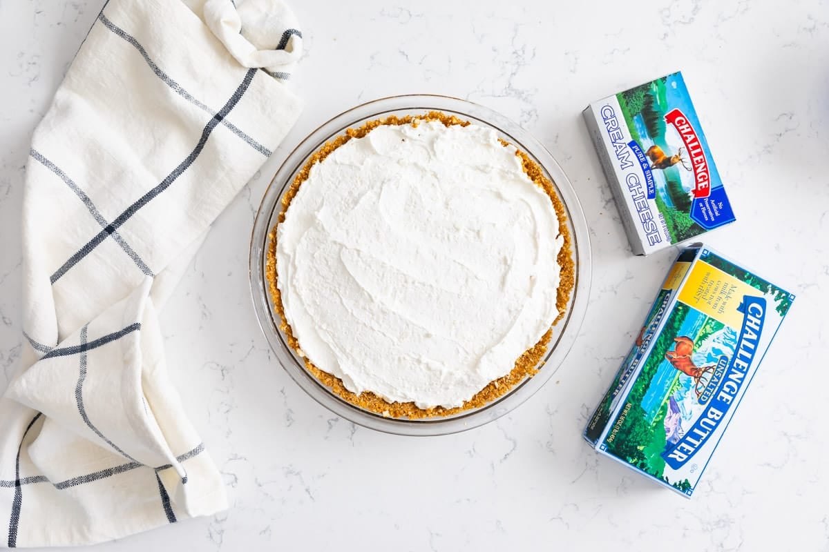 pie with no bake cheesecake inside and butter boxes.
