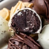 oreo truffles mixed in a white bowl with words on top