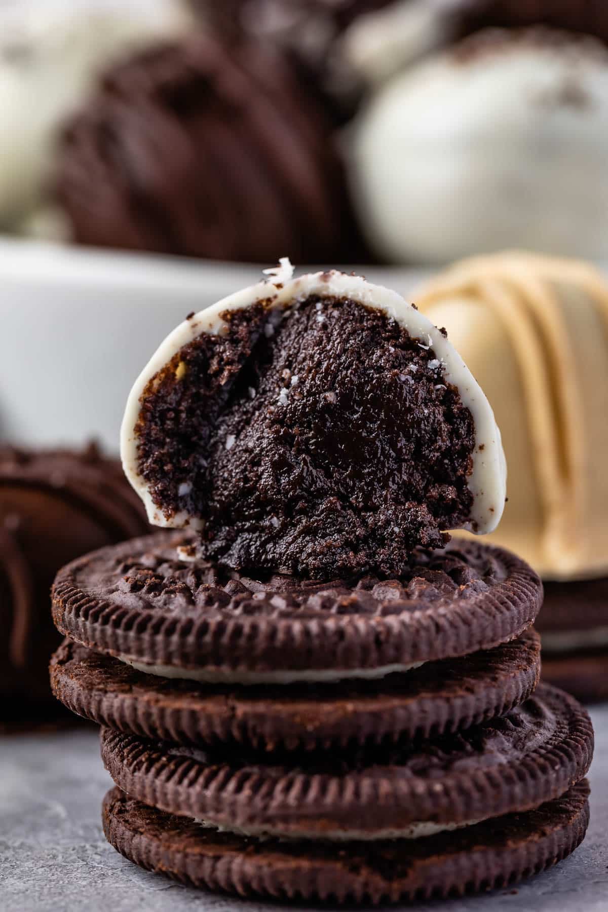 half of a oreo truffle on top of stacked oreo