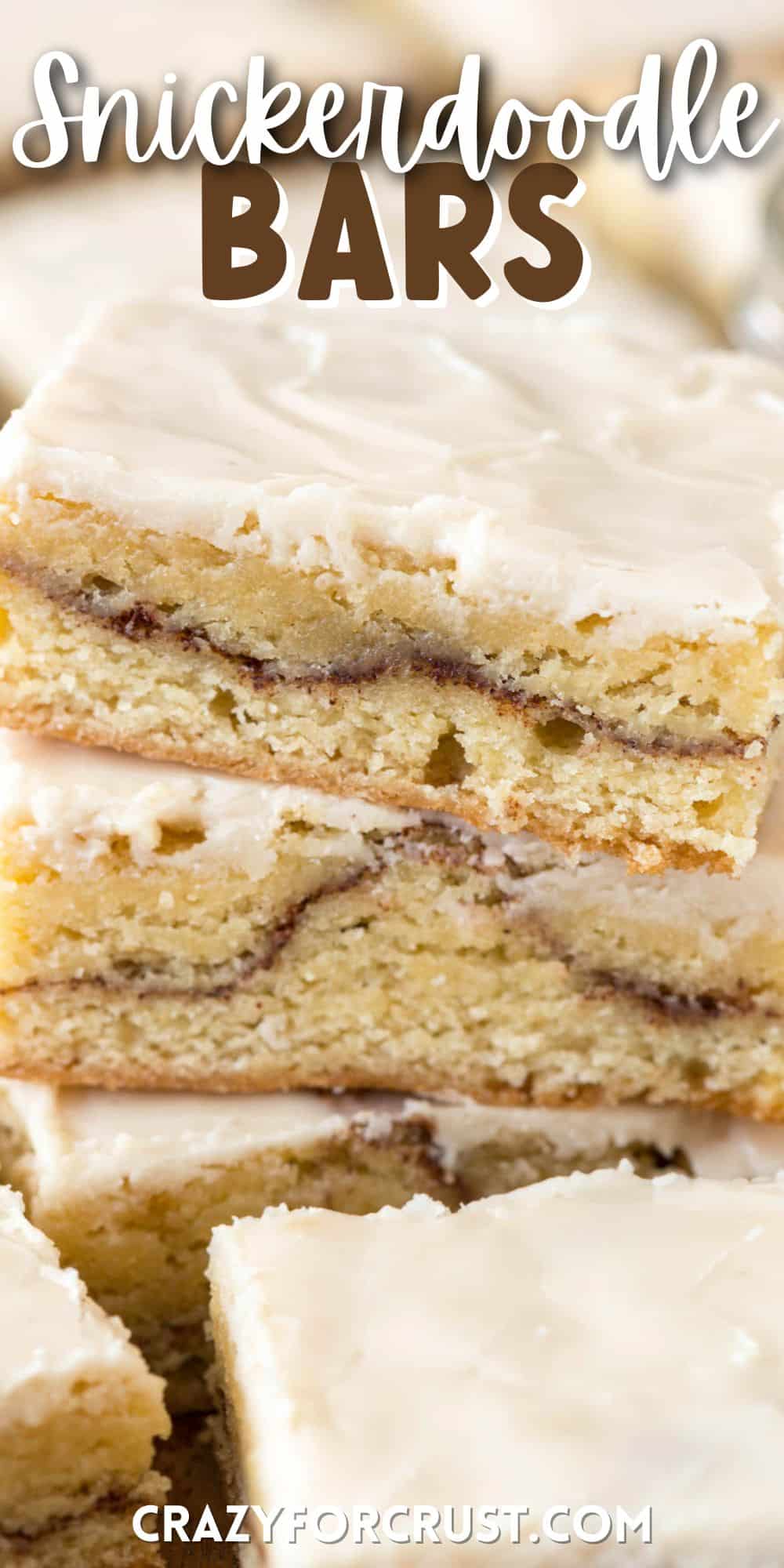 snickerdoodle bars stacked on a cutting board with words on top