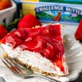 slice of pie on white plate with fork.