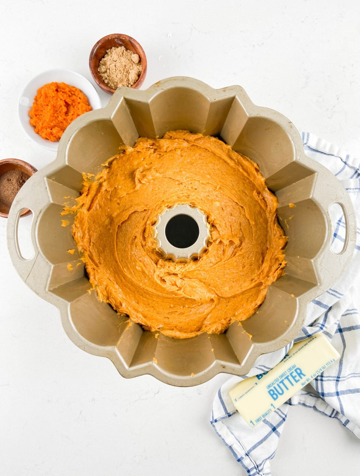 pumpkin bundt cake batter in pan.