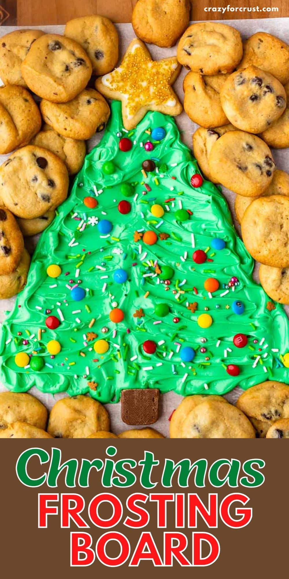 frosting on board decorated like a christmas tree surrounded by mini chocolate chip cookies