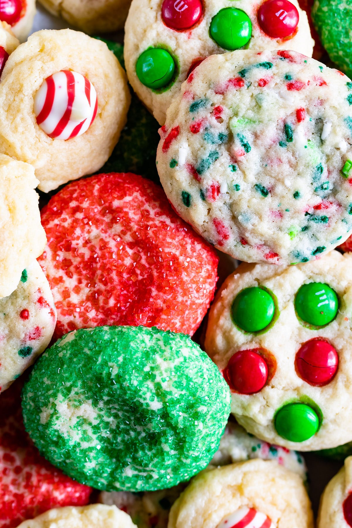 different styled christmas cookies with red and green ingredients baked into the cookies