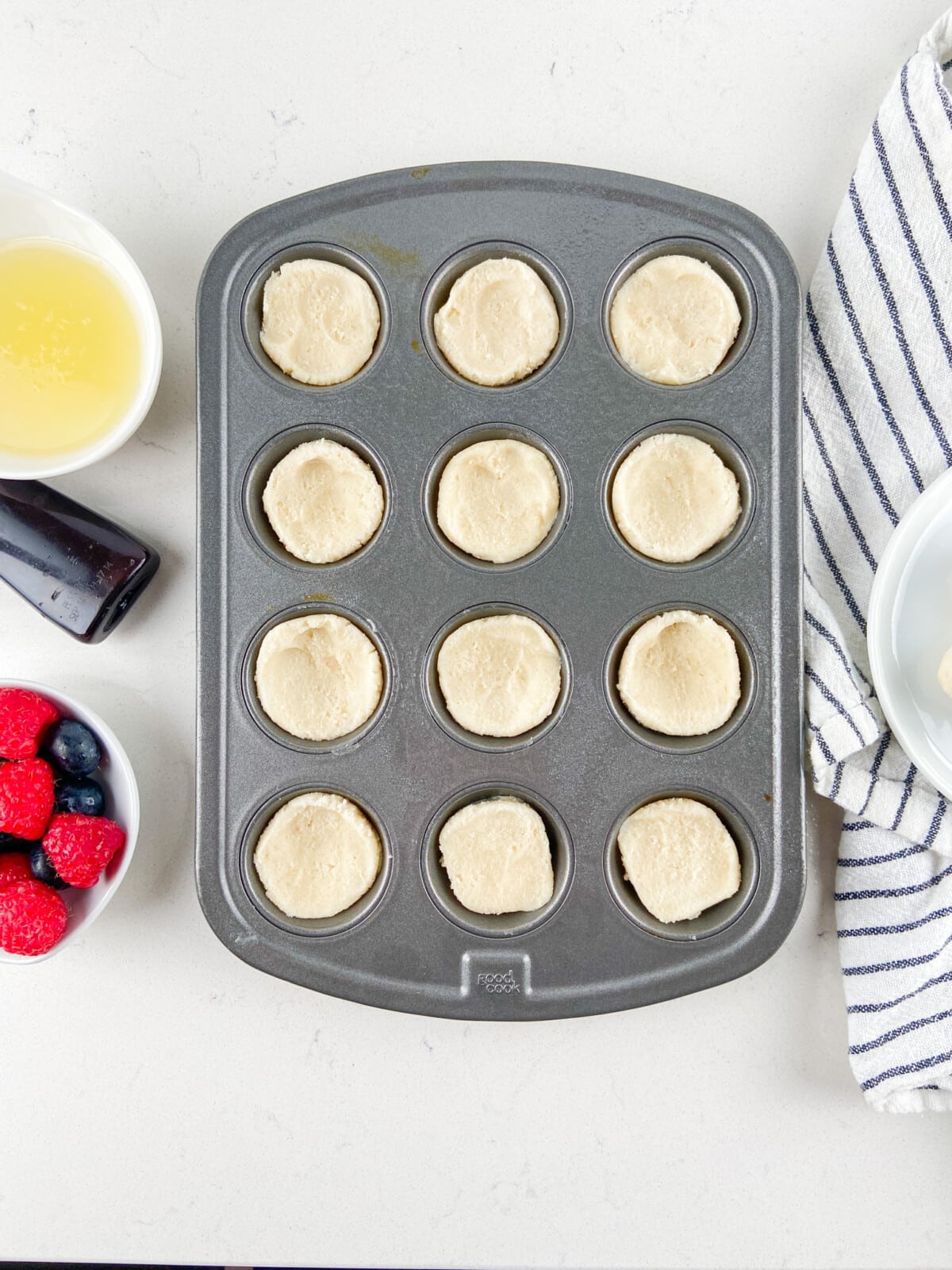 cookie dough in mini muffin pan.