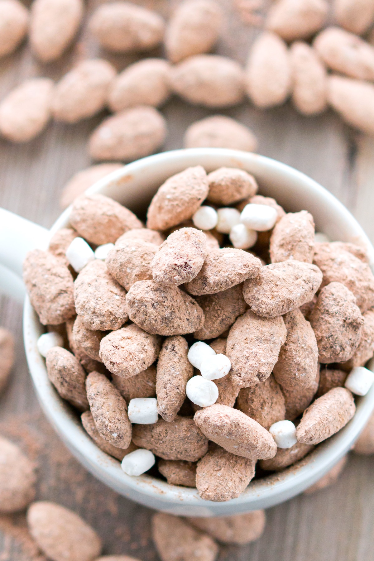 almonds in a white bowl mixed in with mini marshmallows