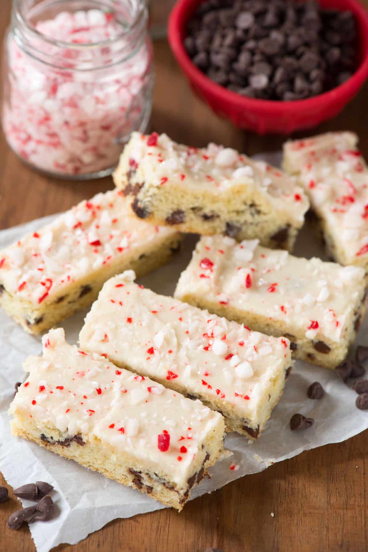 chocolate chip cookie sticks with white icing and crushed peppermint on top