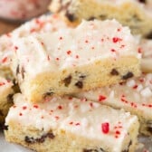 chocolate chip cookie sticks with white icing and crushed peppermint on top