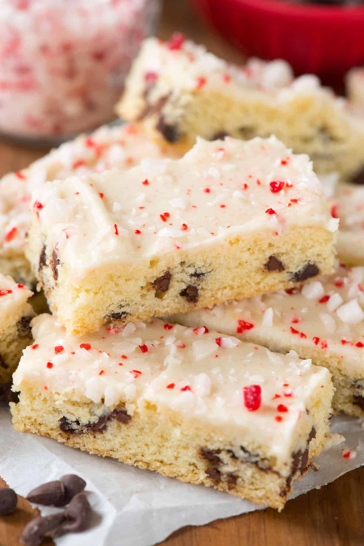 chocolate chip cookie sticks with white icing and crushed peppermint on top