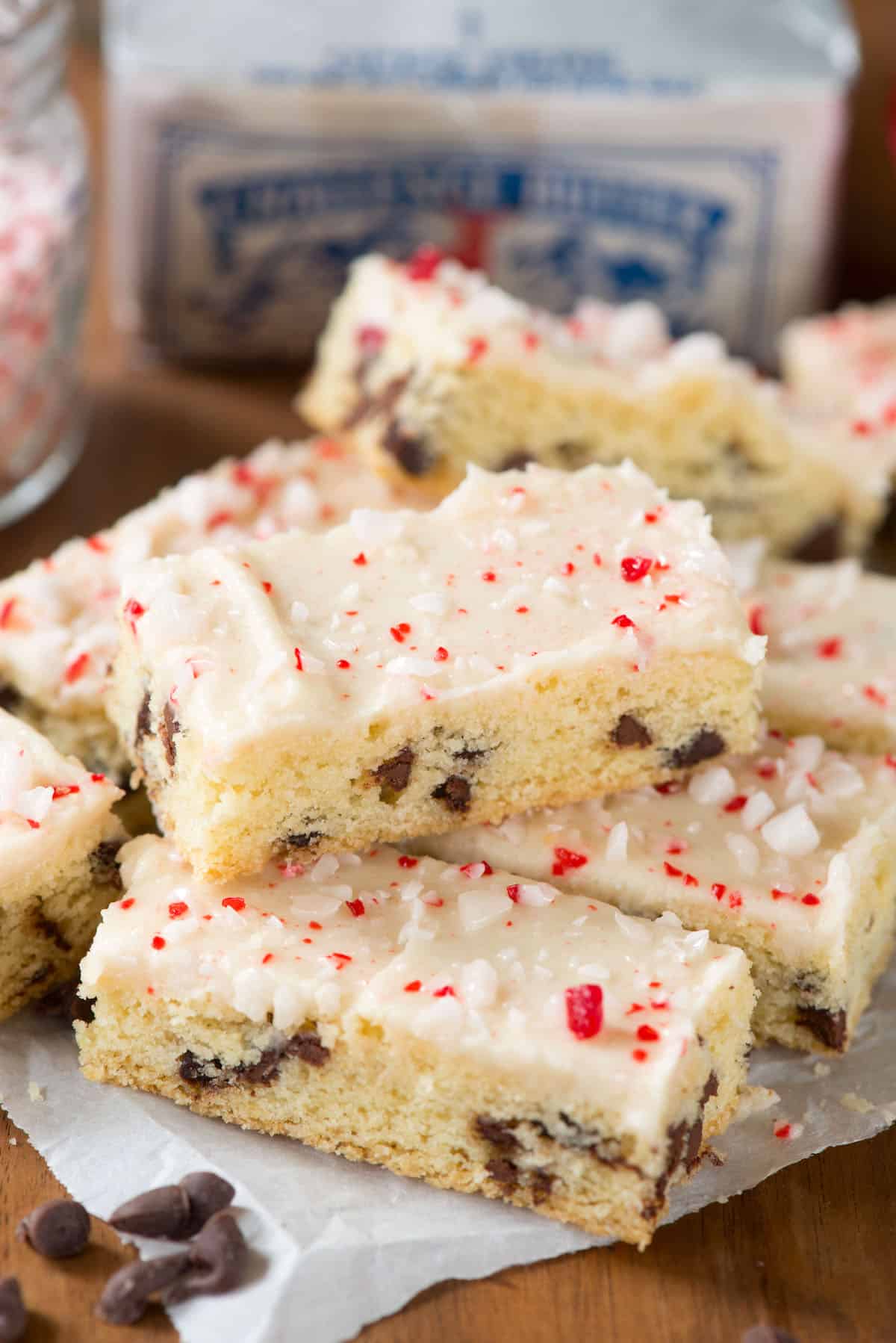 chocolate chip cookie sticks with white icing and crushed peppermint on top