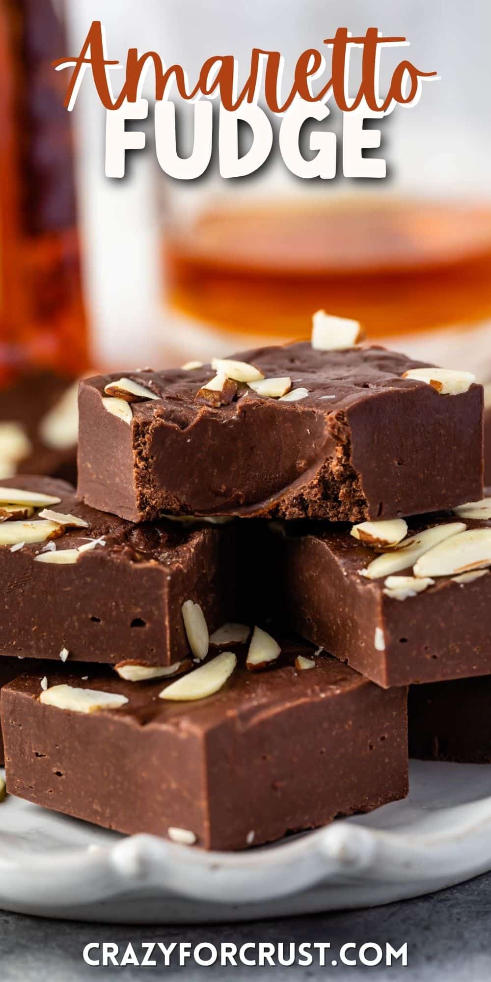 brown fudge with shaved almonds on top and words on top