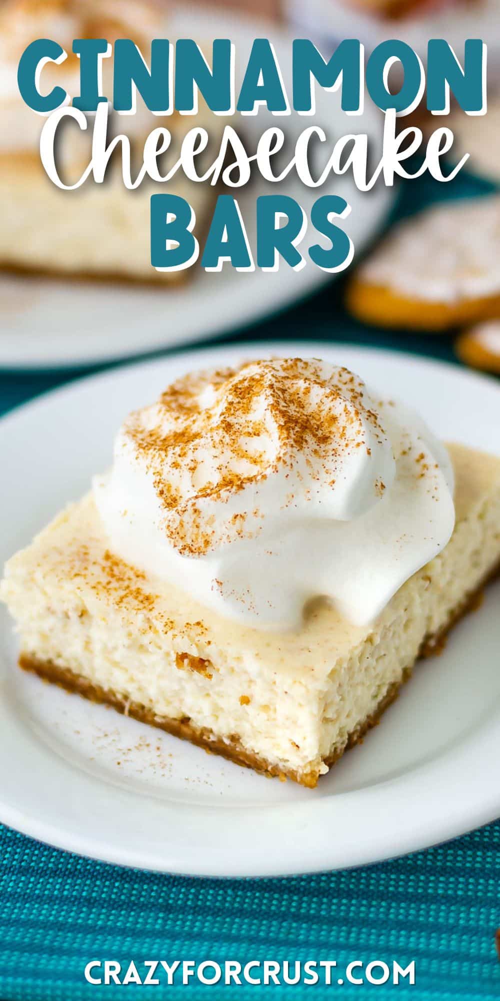 one square slice of cheesecake bars on a white plate with words on the photo saying the name of the recipe with words on top