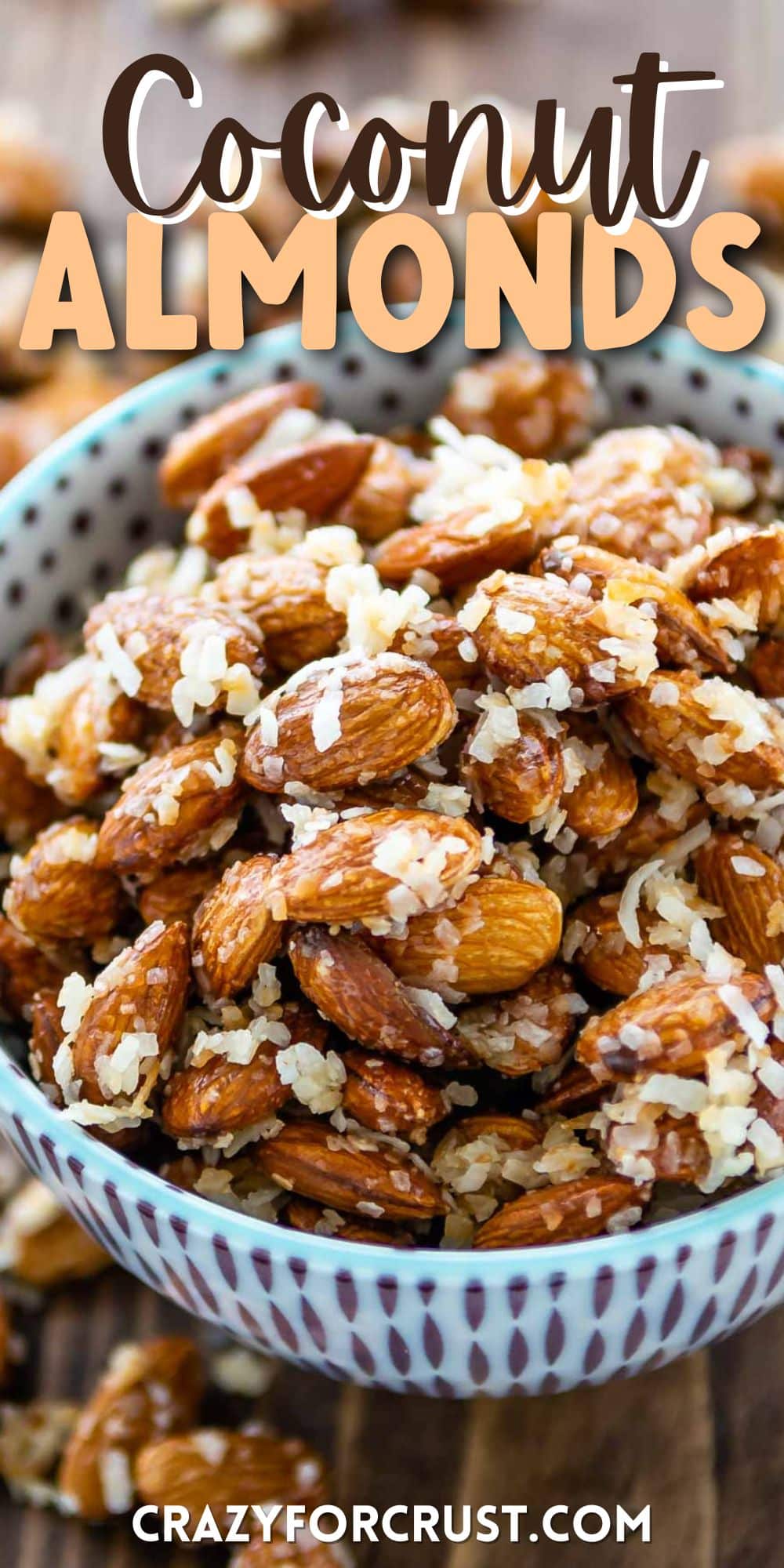 almonds in a blue and purple bowl covered in coconut shreds with words on top