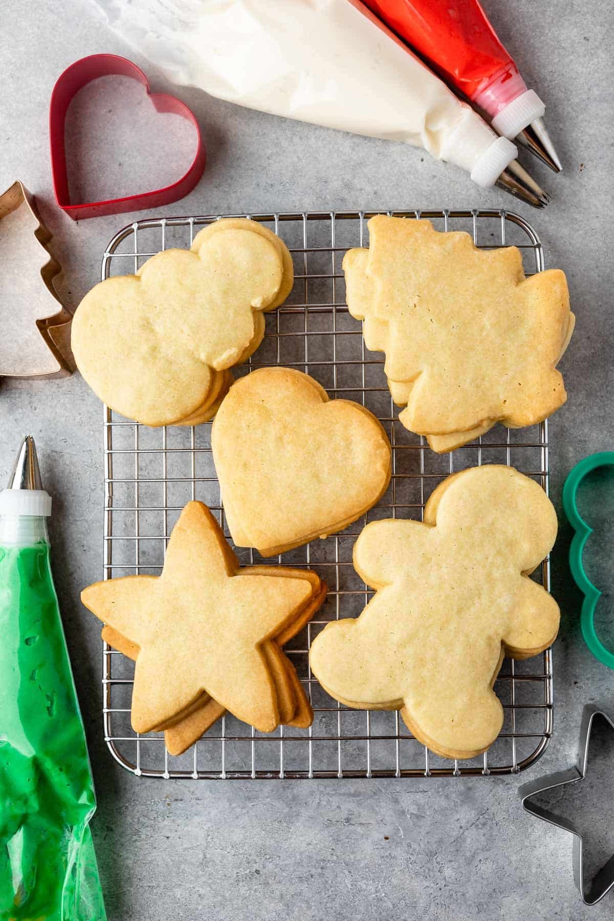 sugar cookies stacked on a drying rack