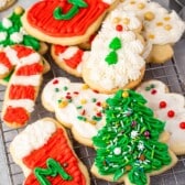 christmas shaped cookies with frosting decorating the cookies