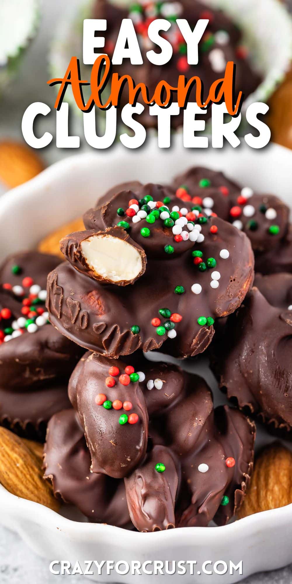 clusters covered in chocolate in a white bowl with colorful sprinkles on top and words on top