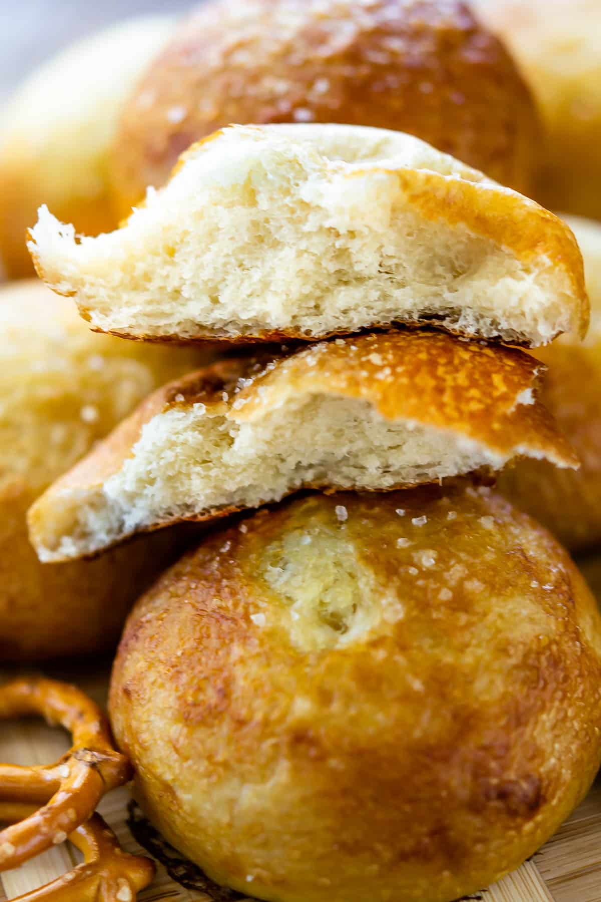 pile of pretzel rolls with one cut in half