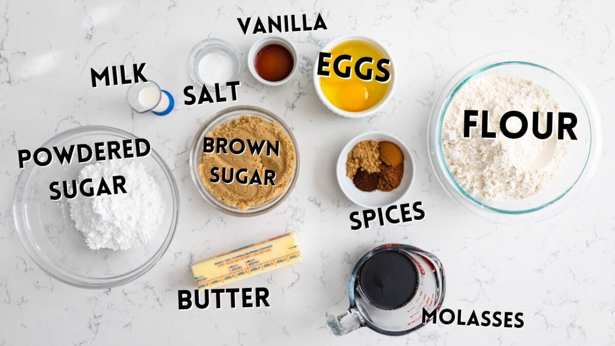ingredients in gingerbread cookie cake laid out on a white counter
