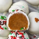 gingerbread truffles covered in white chocolate and green and red sprinkles with words on top